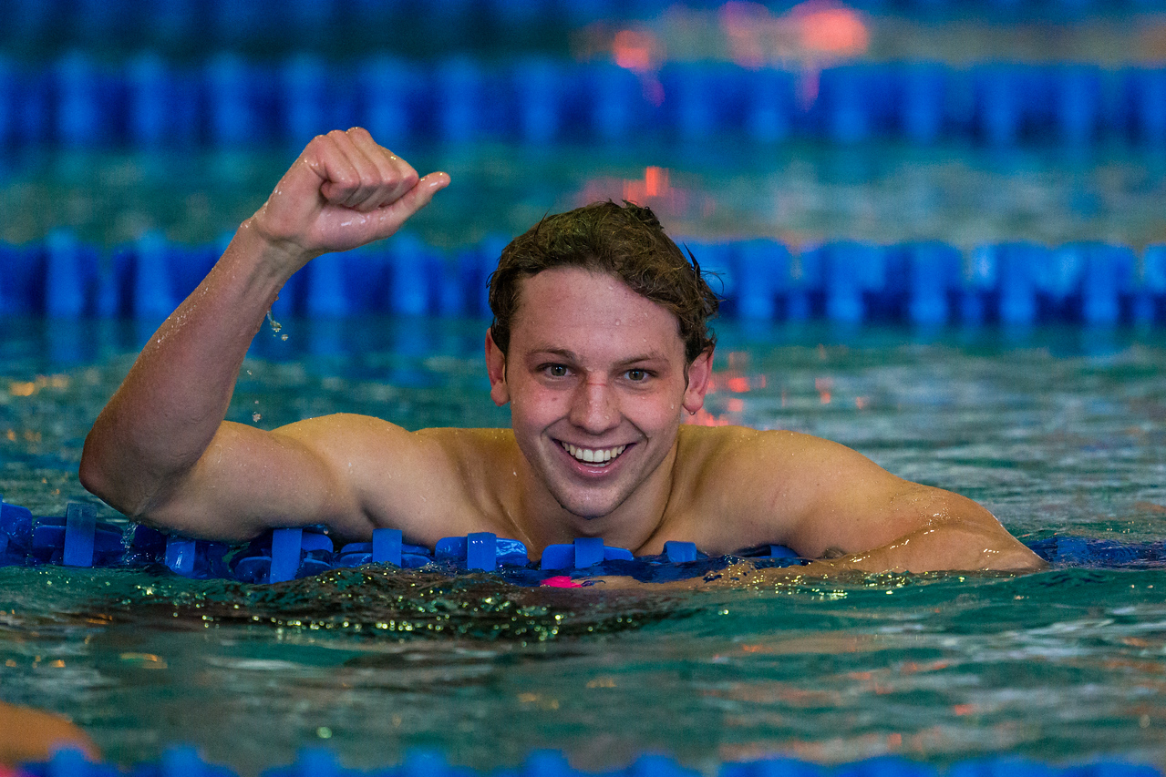 Nils Bognar smiling at the wall after a race
